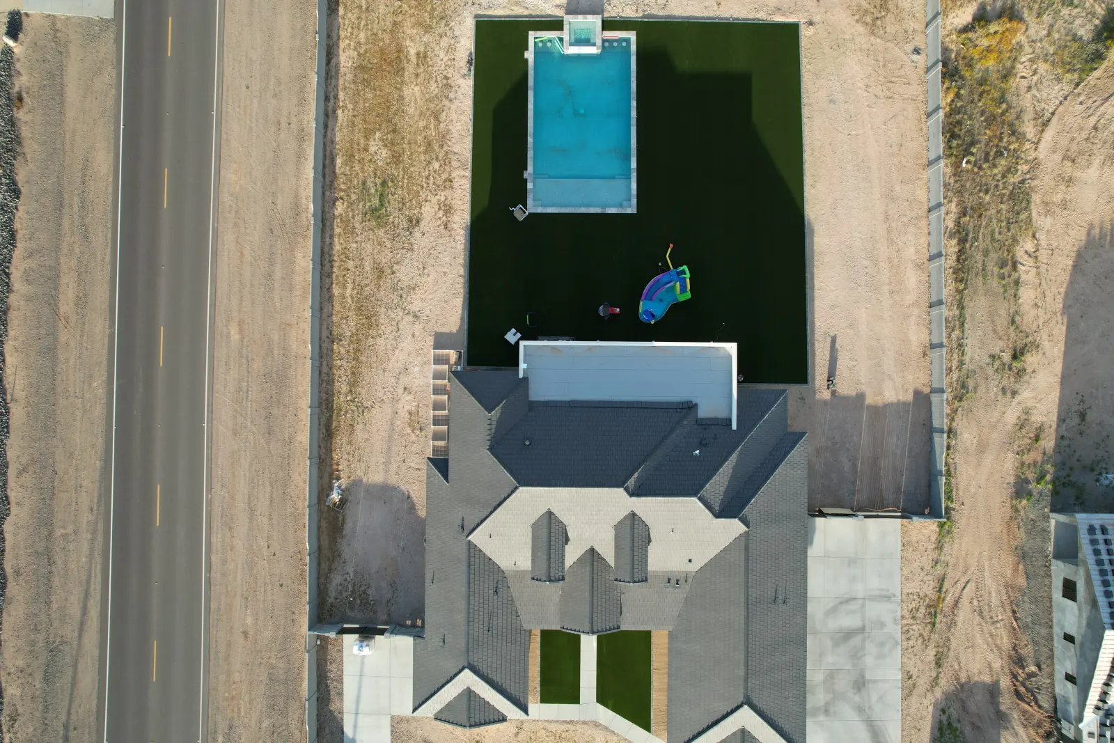 Drone view of a Lush 70 artificial turf lawn by The Turf Yard