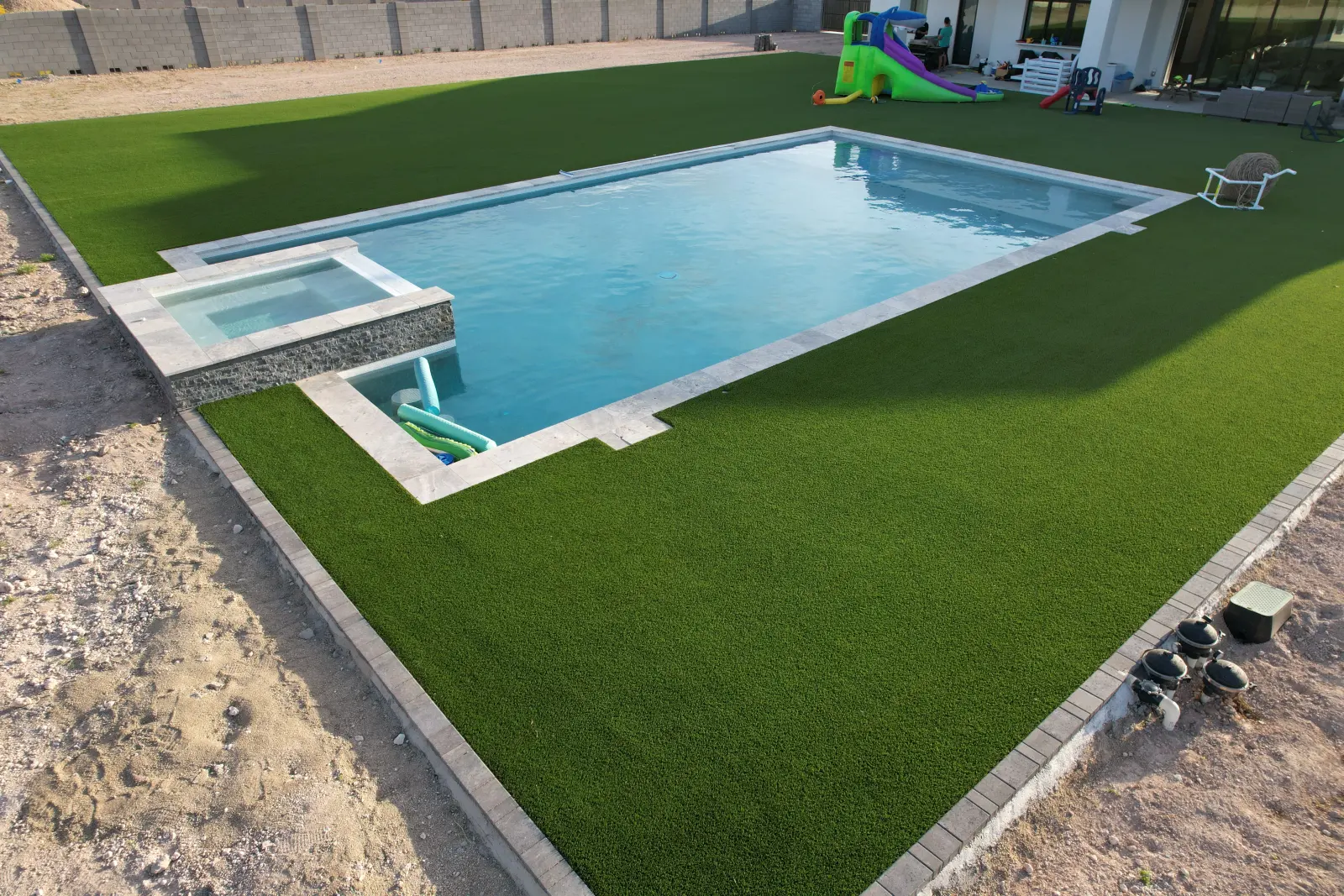 Wide aerial view of a Lush 70 artificial turf lawn installed by The Turf Yard