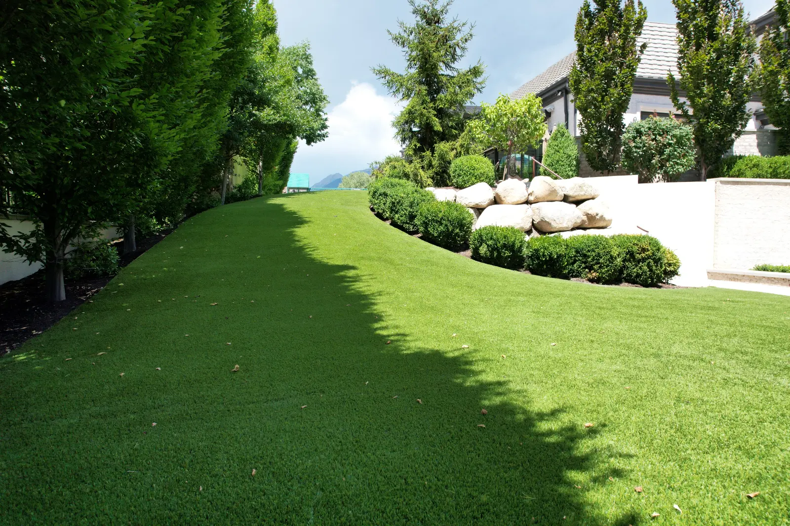 Wide aerial view of a Lush 80 artificial turf lawn installed by The Turf Yard